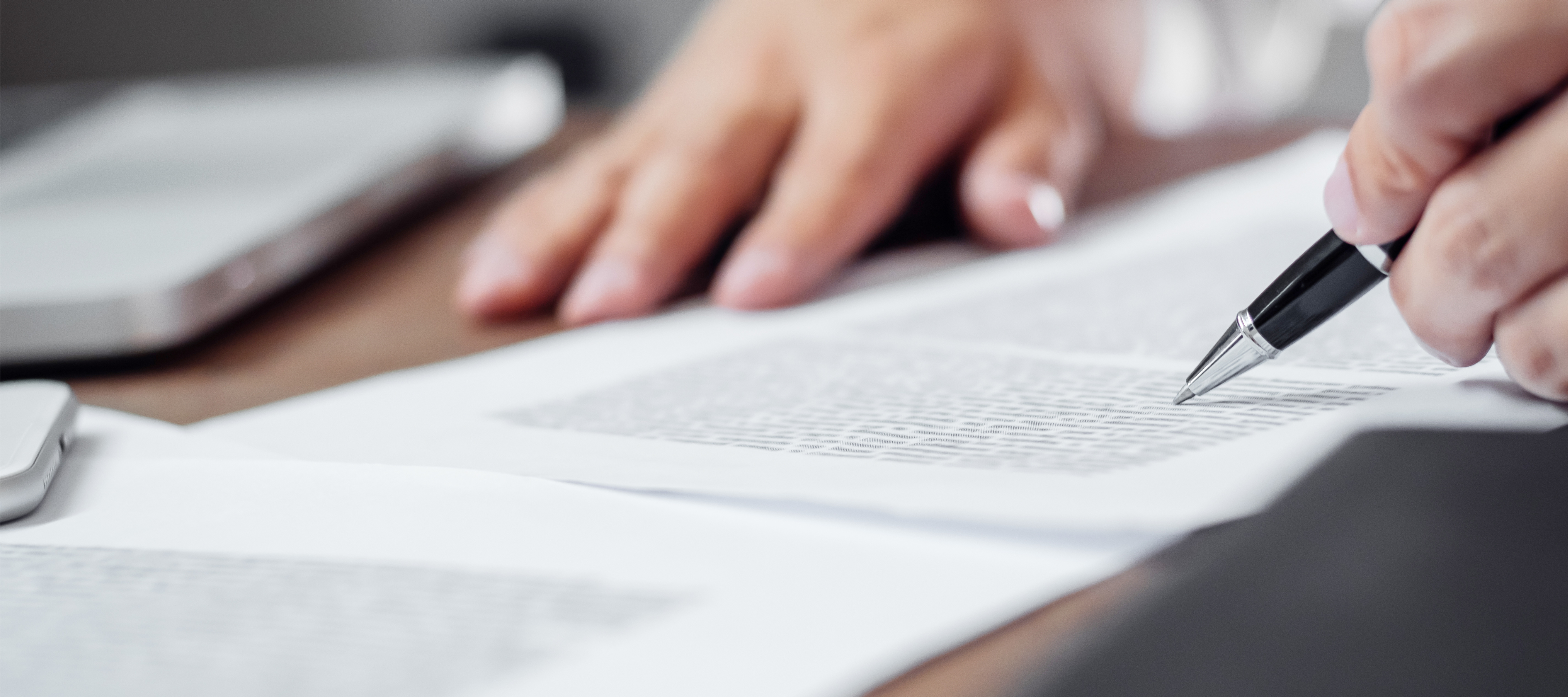 Insurance agent discussing policy options with a client in an office setting