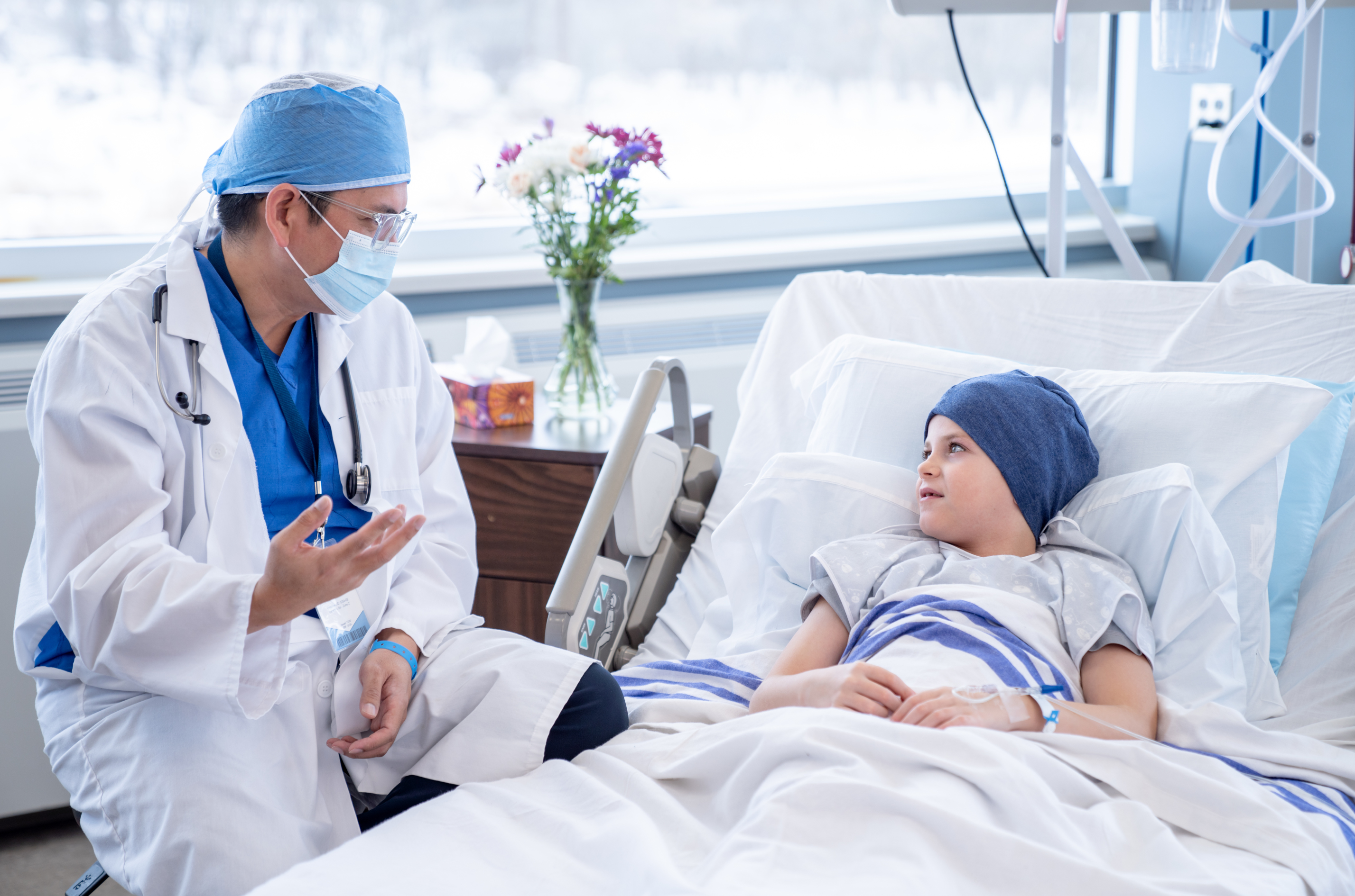 Oncologist discussing treatment plans with a cancer patient in a hospital setting